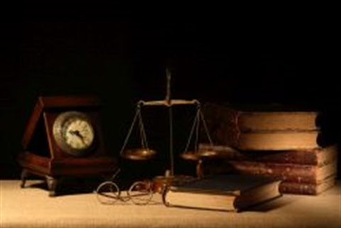 Legal books with scale and clock