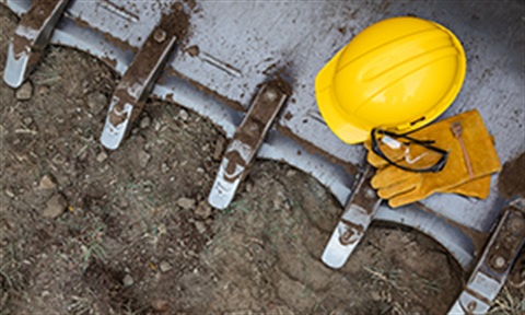 Construction equipment sitting dirt.